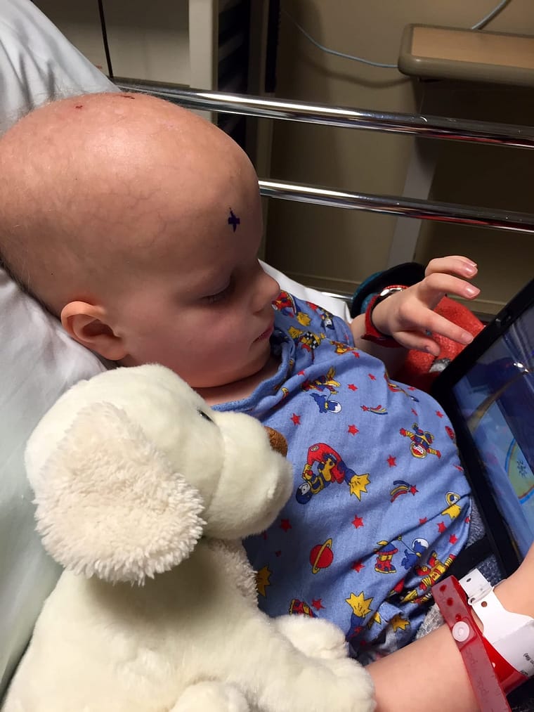 Chase and his puppy, "Biscuit" in pre-op. "X" marks the eye designated for surgery.