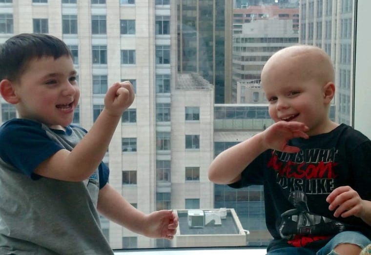 Chase and his friend, Matthew, meet up and play "got your nose" in the Crowne Sky Garden after their appointments.